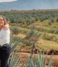 Retired couple in front of agave fields. Cheap Mexican auto insurance.