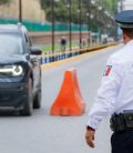 Police man regulating traffic in Mexico. Cheap Mexican car insurance.