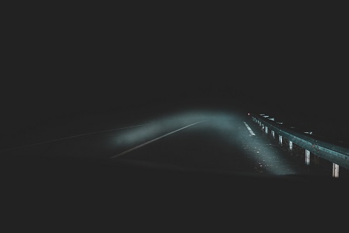 car driving on road at night