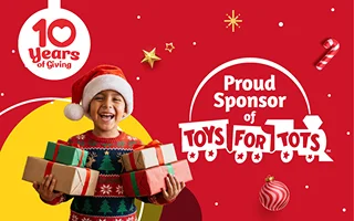 Child holding toys, festive background.